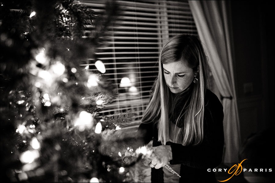 beautiful woman decorating a christmas tree by seattle wedding photographer cory parris