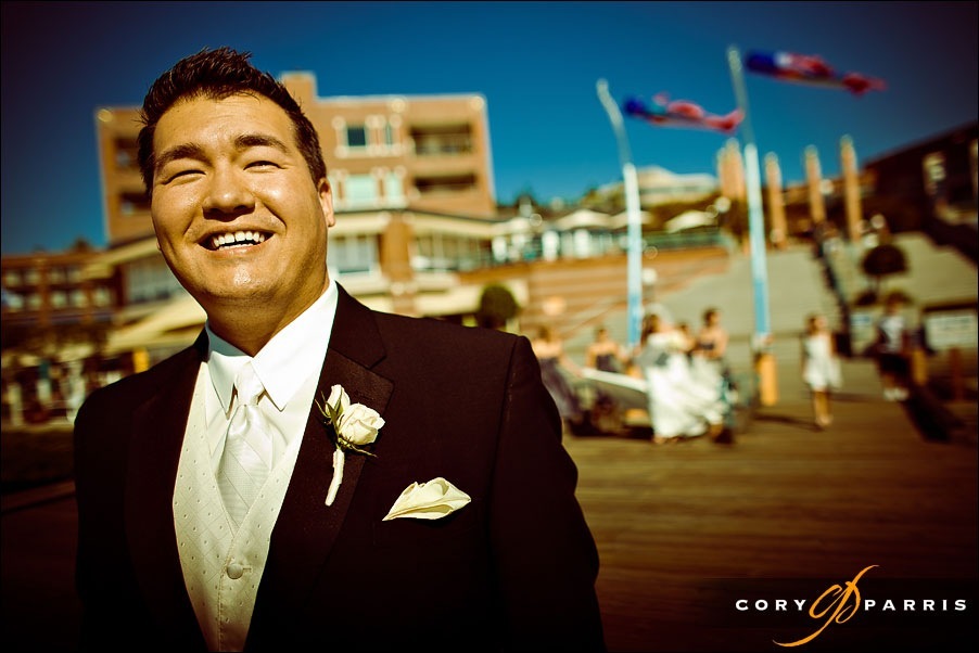 groom waiting to see bride on the dock at the woodmark hotel by seattle wedding photographer cory parris
