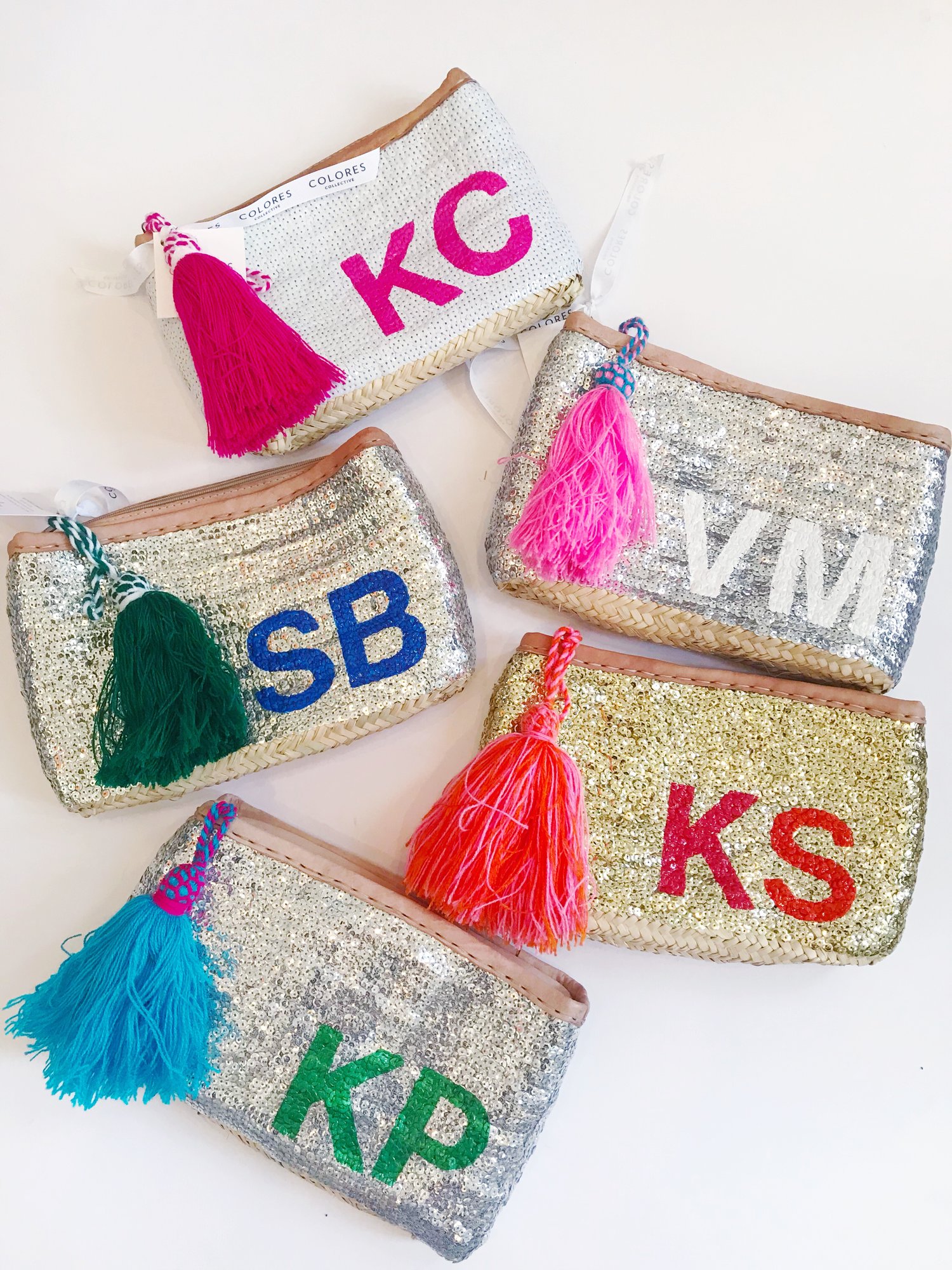 Monogram straw clutch with tassels — COLORES COLLECTIVE