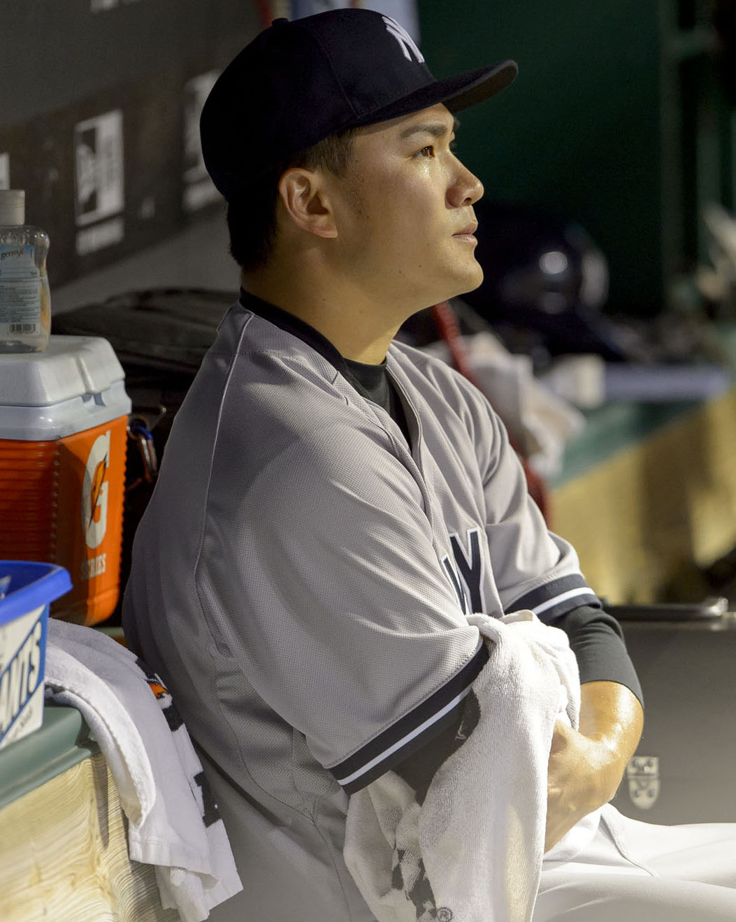 Starting pitcher Masahiro Tanaka #19 of the New York Yankees sits in the dugout after leaving the game during the seventh inning against the Cleveland Indians on July 8th, 2014 