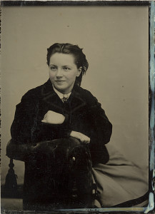 ca. 1856-1910, [tintype portrait of a smiling and sharply dressed young lady] via Harvard College Fine Arts Library, Special Collections