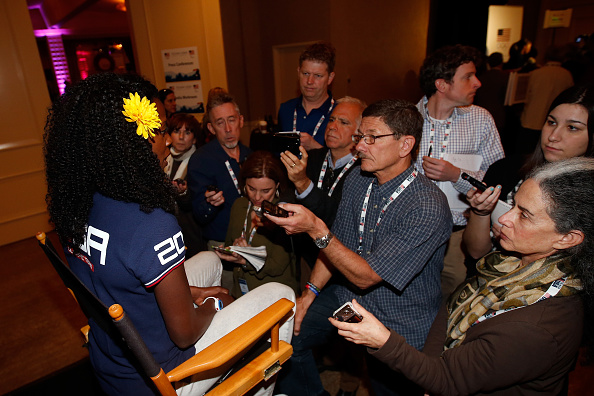 Alysia Montaño surrounded by reporters at the USOC media summit // photo Getty Images 