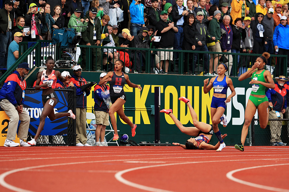 Just after the finish in the 200: Tori Bowie, left, is the winner; Jenna Prandini, on the ground, is third; Allyson Felix, in blue, fourth; Deajah Stevens, right in green, second // Getty Images 