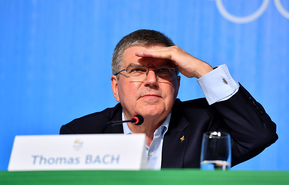 The IOC president. Thomas Bach, at Sunday's news conference and, snark aside, he is looking out through the lights to try to see who is asking him what // Getty Images 