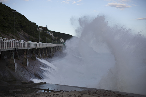 Waves battering the incline near the collapsed bike path // Getty Images 