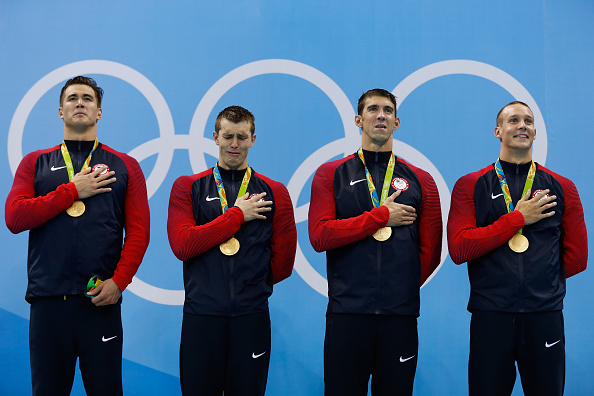 From left, Nathan Adrian, Ryan Held, Michael Phelps and Caeleb Dressel on the medals stand // Getty Images 