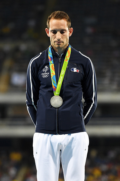 Pole vault silver medalist Renaud Lavillenie on the medals stand // Getty Images 