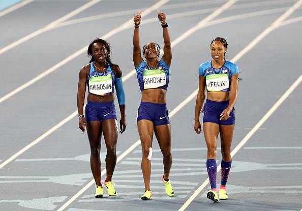 Morolake Akinosun, English Gardner and Allyson Felix after qualifying in the re-run // Getty Images 
