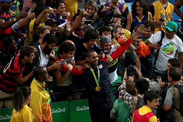 Gold medalist Carmelo Anthony celebrates with the crowd after the U.S. men's 96-66 victory over Serbia // Getty Images