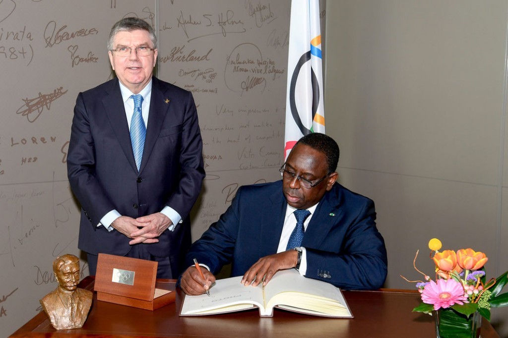 This job would age anyone. IOC president Thomas Bach, left, this week at headquarters in Lausanne, Switzerland, with Macky Sall, president of Senegal // IOC