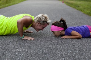 Mother and daughter doing push-ups