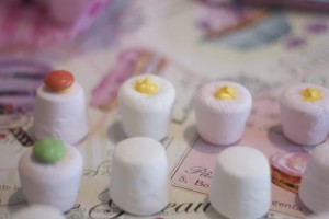 Marshmallows with yellow candy melt chocolate and Smarties