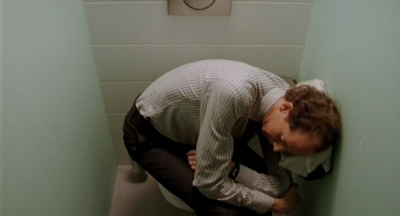 Ivan (Oscar van Rompay) trying to sleep at toilet of Cahen & Greeson