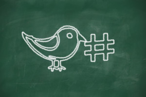 Drawing of a bird holding a hashtag for social media tag