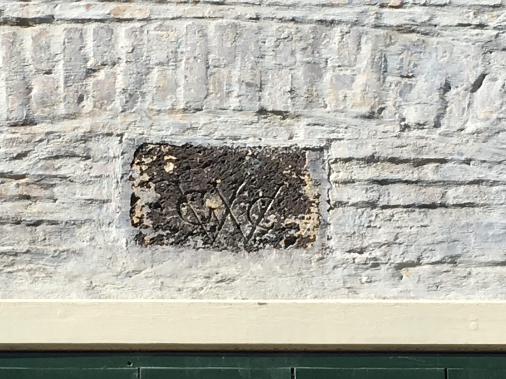 The last remaining Dutch West India Company logo on Statia. It sits above the doors to the former customs and scale house, which is now part of the Scubaqua Dive Center.