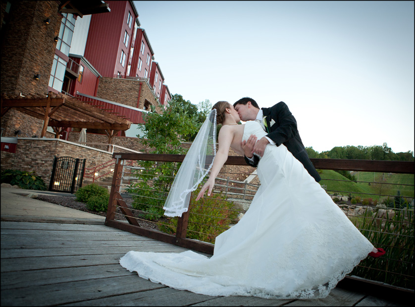 Wedding photo of happily married couple outside The Lodge at Bear Creek Mountain Resort
