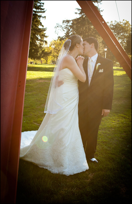 Couple kisses after marrying in the Chapel at Muhlenberg College