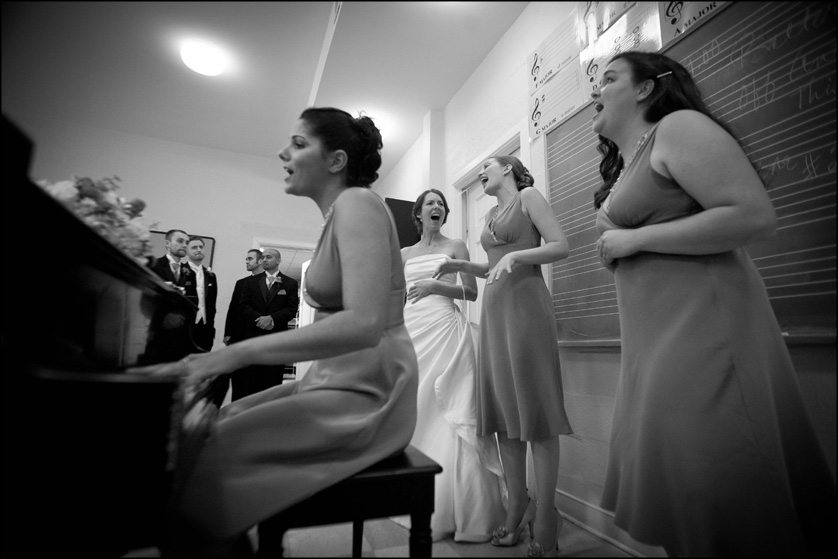 bridesmaids sing and play piano after wedding ceremony at Presbyterian Church of Chestnut Hill