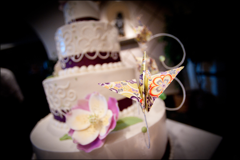 cake with purple details and paper crane
