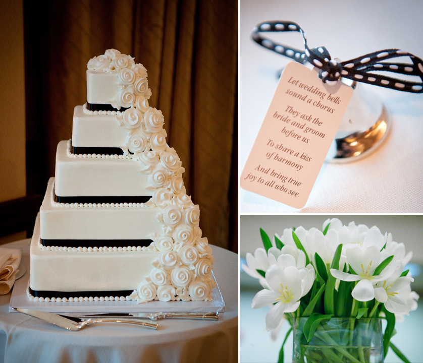 White wedding cake with black ribbons and white flowers
