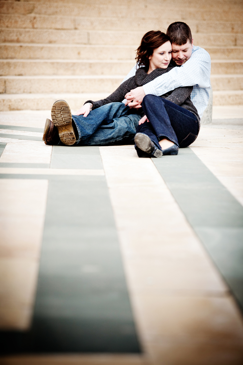 Stone pattern on ground frames cuddling couple at Philadelphia Museum of Art
