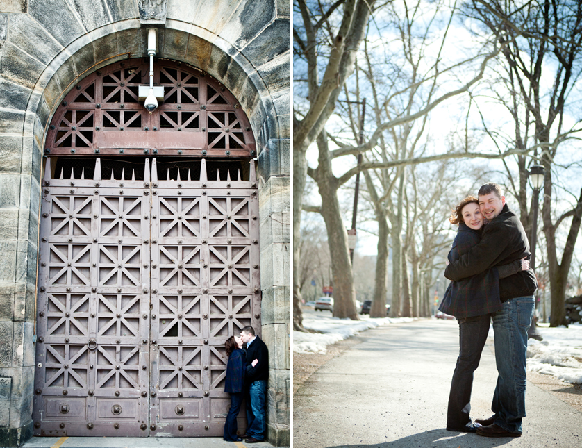Cool cast iron door with stone arch frames kissing couple; cuddling on bike path behind art museum, Philadelphia, PA