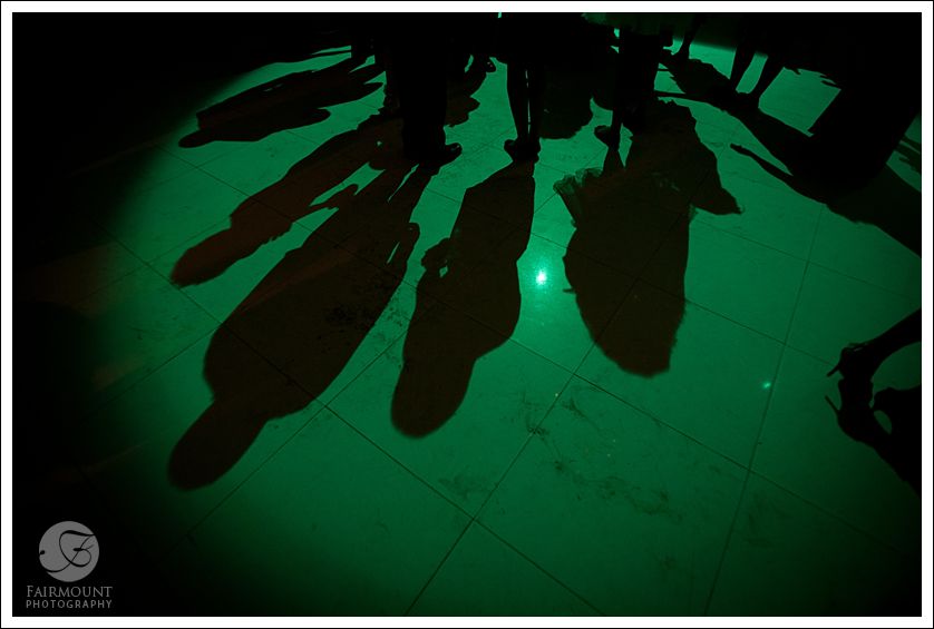 Shadows on dance floor with green lighting