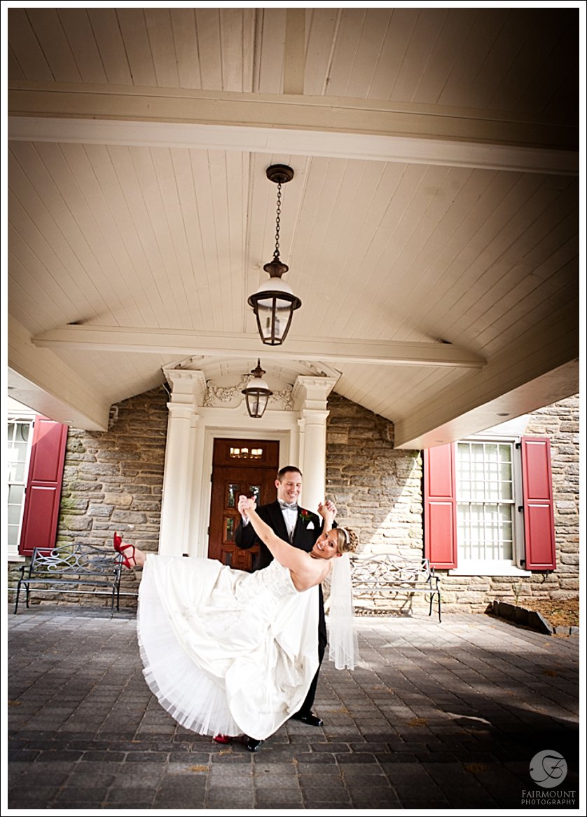 Bride and Groom portrait under portico at Meadowlands Country Club