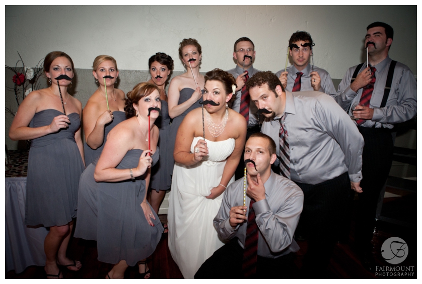 wedding party with moustache props