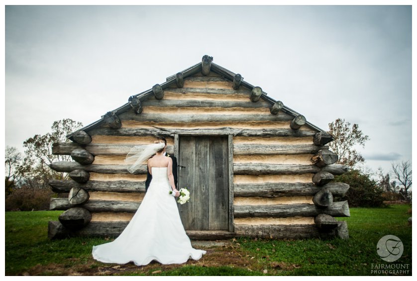 wedding day portrait at log cabin in Valley Forge Park