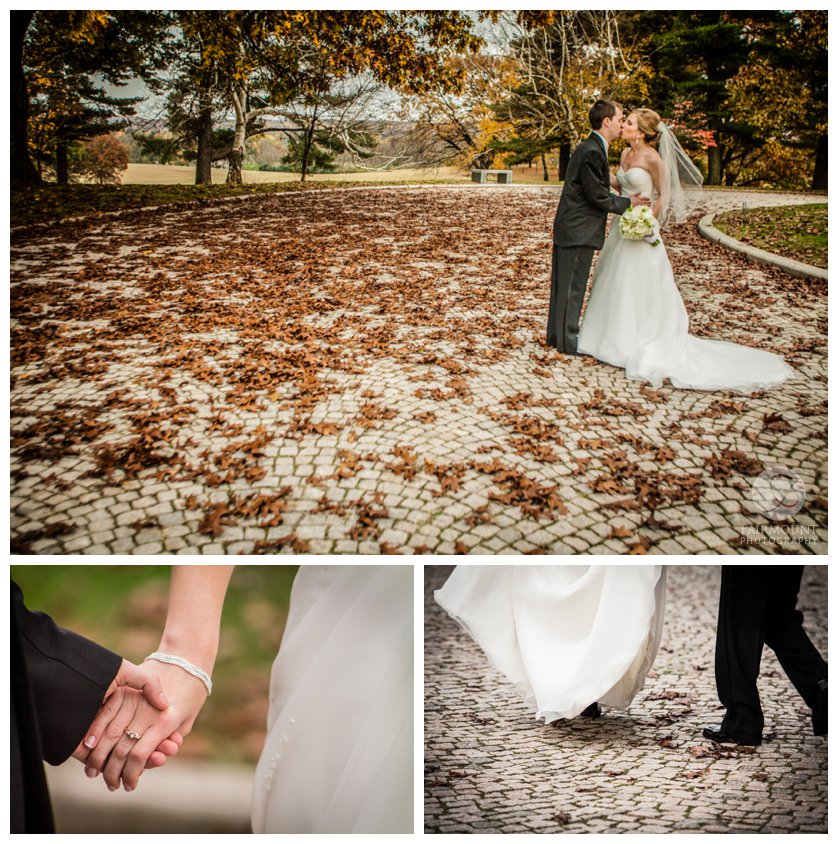 Bride & groom kiss on a cobblestone pathway covered by leaves at Valley Forge Park
