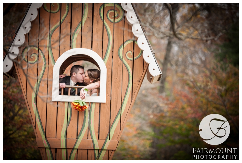 Bride and Groom kissing in a treehouse at Tyler Arboretum