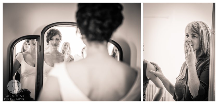 mother of the bride looks on as bride checks herself out in the mirror