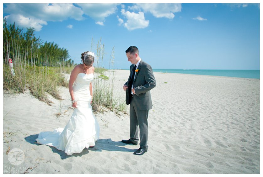 white sand, turquoise ocean and a beautiful bride and groom at beach first look