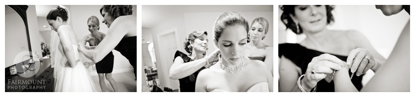 Bride gets help while getting ready