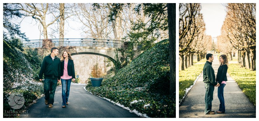couple holding hands and walking down road in winter engagement photos