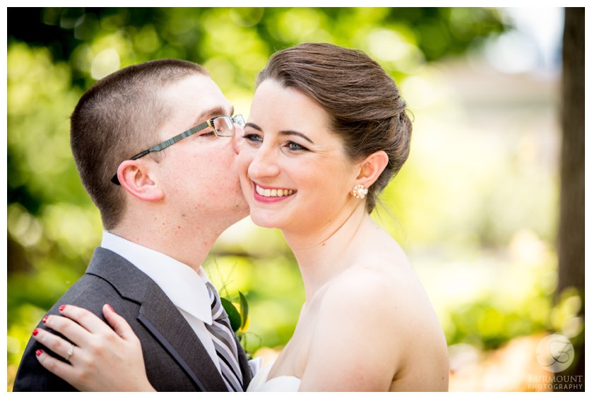 groom kisses bride on the cheek before June wedding in Philadelphia