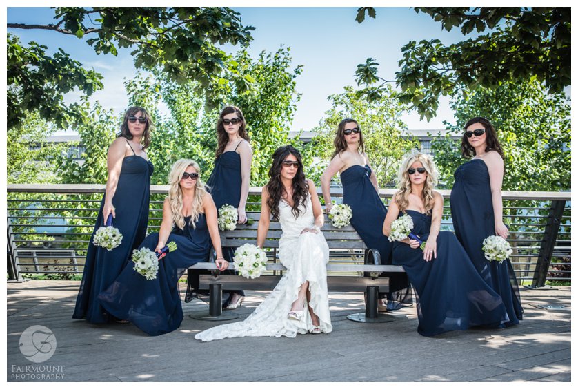 bridesmaids wearing sunglasses on Race Street Pier
