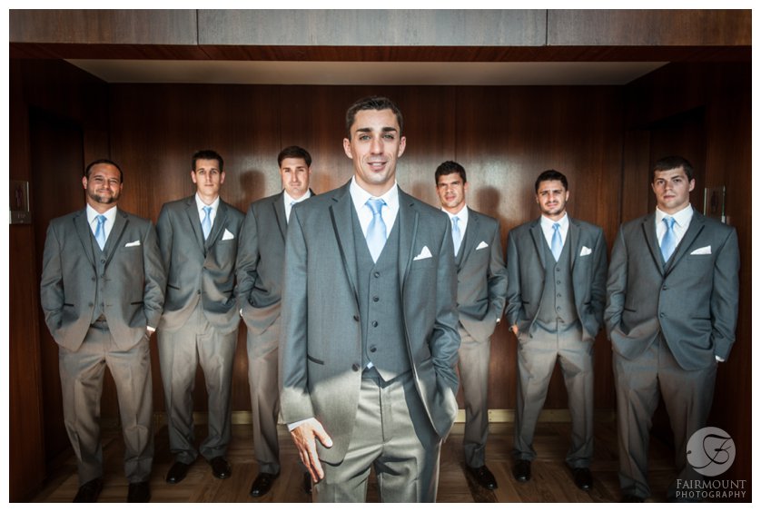 groomsmen wearing charcoal suits with pale blue ties
