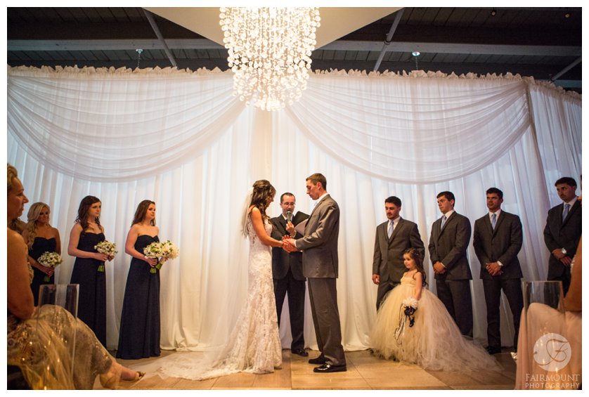 elegant wedding ceremony under crystal chandelier