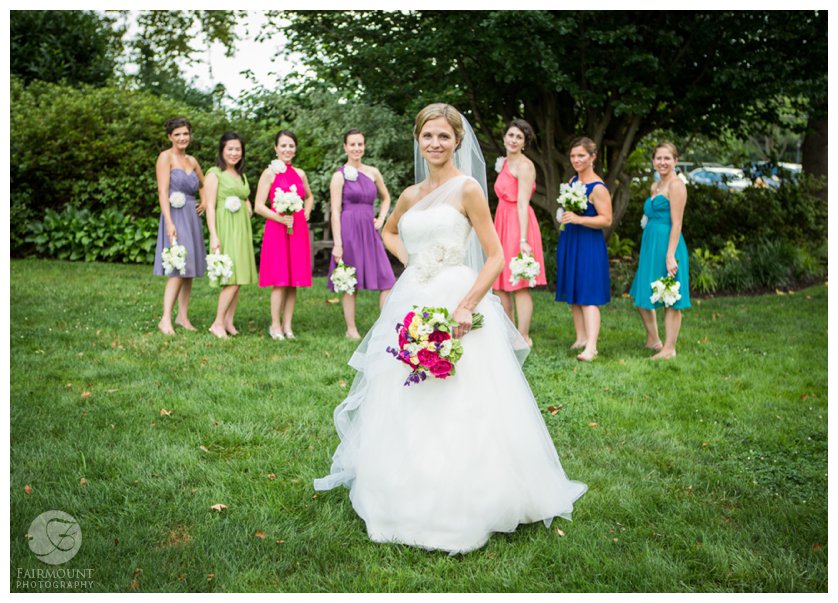 Bridesmaids in various colored dresses
