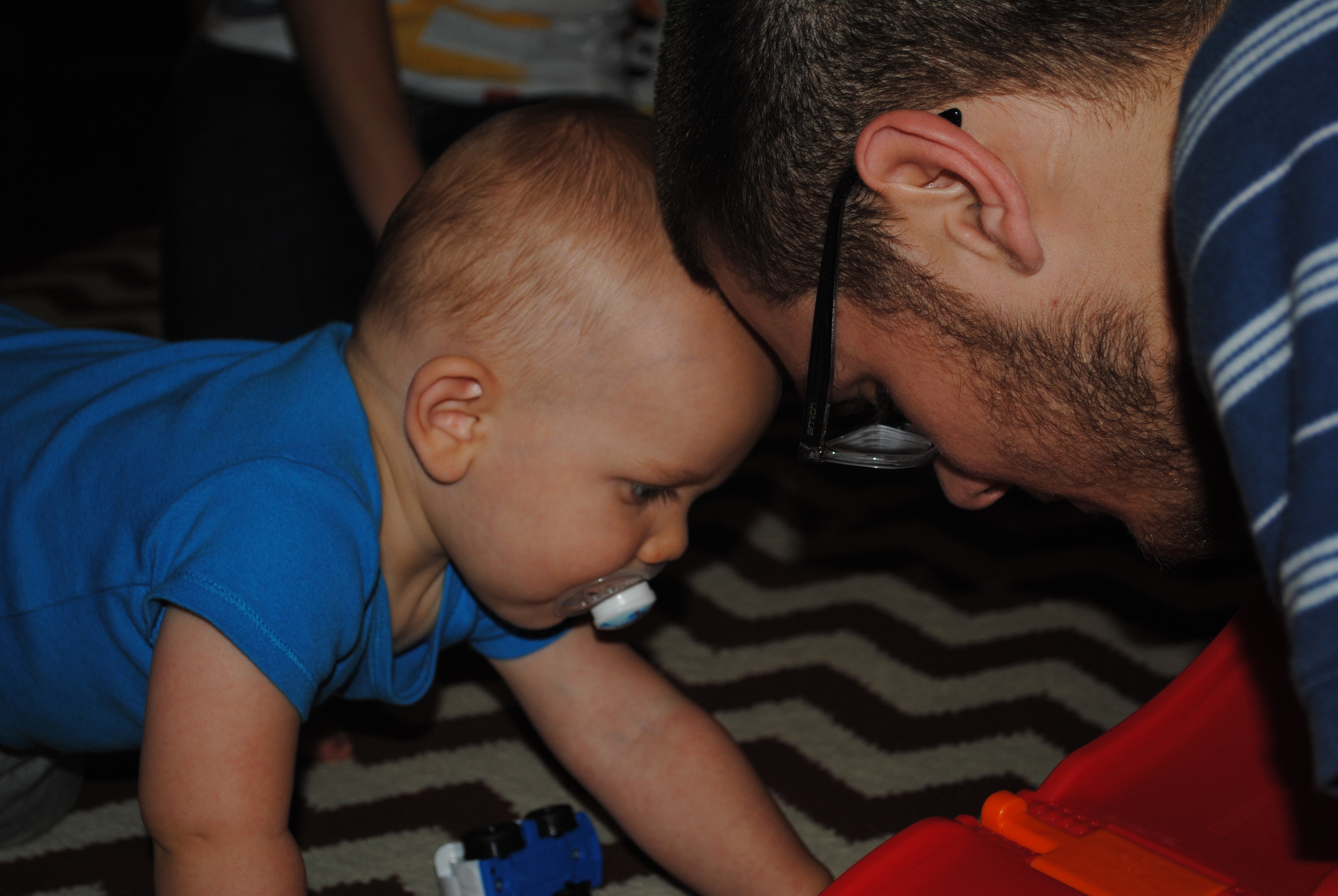 Putting their beautiful heads together. My son playing with his son. A treasured moment in time.