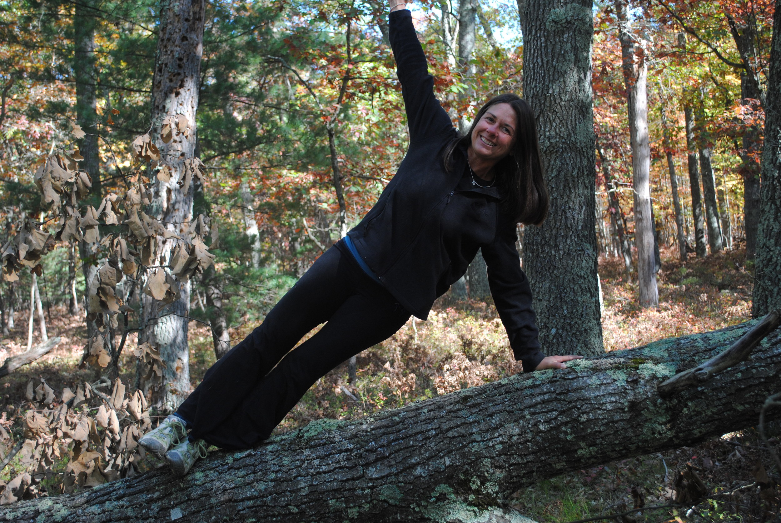 Side planking on a fallen tree. (Super challenging for your balance).