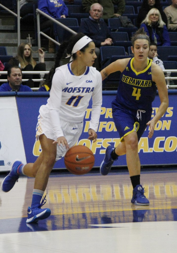 Mike Rudin/The Chronicle Krystal Luciano drives toward Delaware's basket with the ball from midcourt. She scored 13 points and seven rebounds vs. the Fightin' Blue Hens.