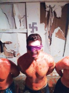 Photo sent to Sigma Pi's national organization allegedly shows student covered in hot sauce, blindfolded and kneeling in front of swastika.
