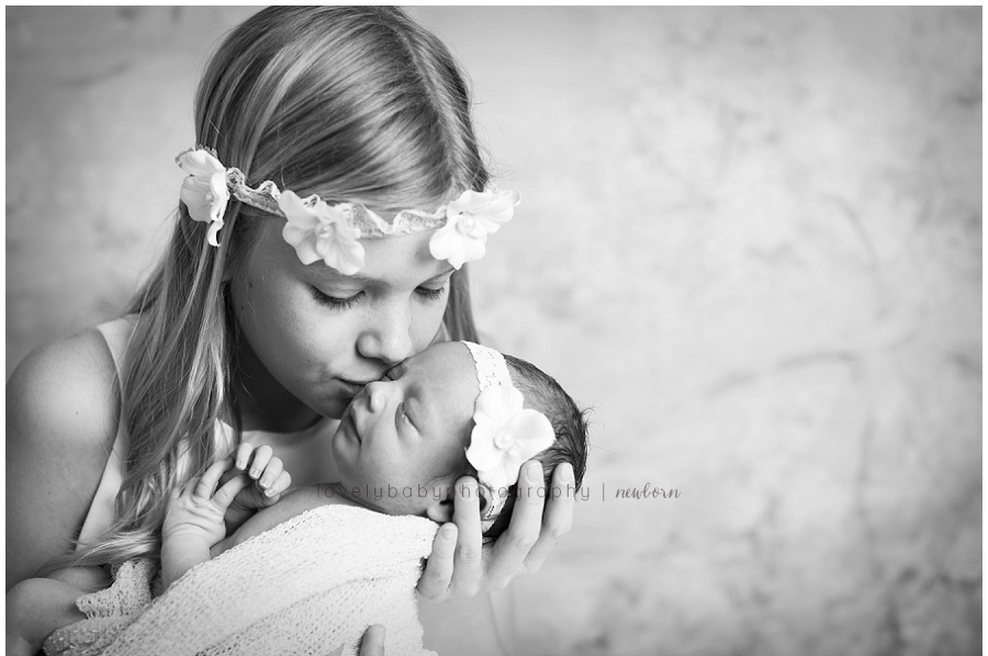 big sister with newborn photography session