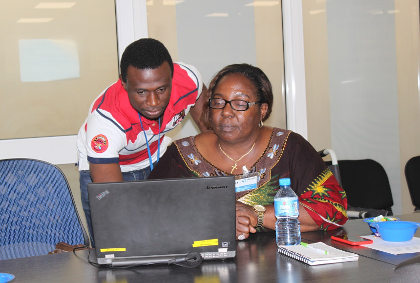 eHA's Samuel Aiyeoribe working with Ministry of Health Director Ifeoma Anagbagu during the training.