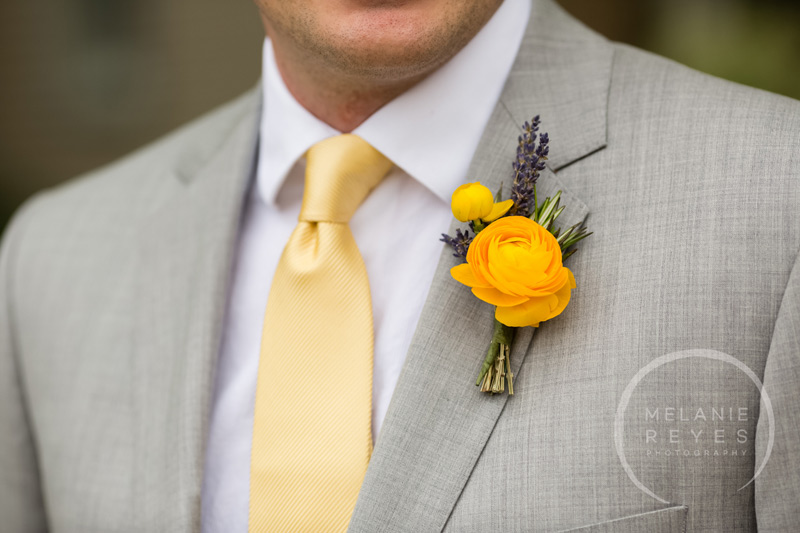 groom boutonniere yellow ranunculus and lavender