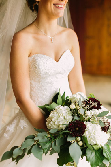 bride bouquet in white ivory and burgundy
