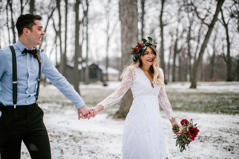 bride and groom enjoying snow